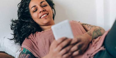 Young woman video chatting on her mobile device