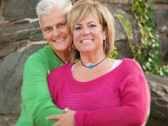 Mature lesbian couple embracing